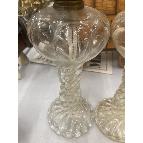 96 - A PAIR OF VINTAGE GLASS OIL LAMPS WITH BARLEY TWIST STEM