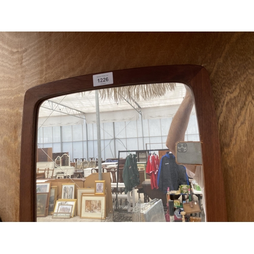 1226 - A TEAK FRAMED WALL MIRROR STAMPED MADE IN DENMARK