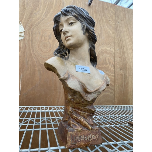 1236 - A RESIN FIGURE OF A FEMALE BUST STAMPED 'LINNOCENCE'