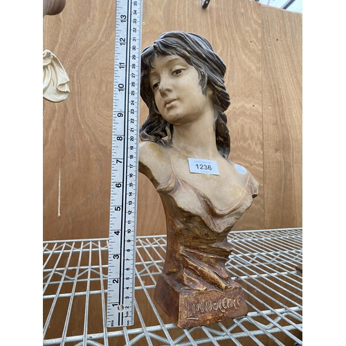 1236 - A RESIN FIGURE OF A FEMALE BUST STAMPED 'LINNOCENCE'