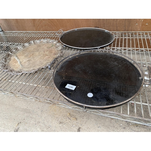 1246 - TWO BLACK GLASS TRAYS WITH METAL GALLERY SIDES AND A LARGEWALKER AND HALL SILVER PLATE SALVER