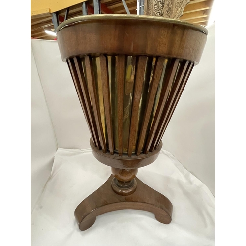 10 - A MAHOGANY BASKET FORM PLANT HOLDER ON TRIPOD BASE