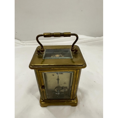 10A - A BRASS CARRIAGE CLOCK BY F A CHANDLER LEMINGTON SPA WITH TOP ESCAPEMENT VEIWING PANE