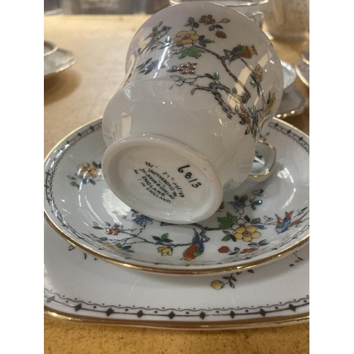 215 - FIVE GROSVENOR CHINA CUPS, SAUCERS AND  FOUR SIDE PLATES WITH A BIRD AND FLORAL DESIGN