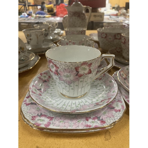 216 - A DELPHINE CHINA TEA AND COFFEE SET IN A PALE PINK FLORAL PATTERN TO INCLUDE A TEA POT, COFFEE POT, ... 