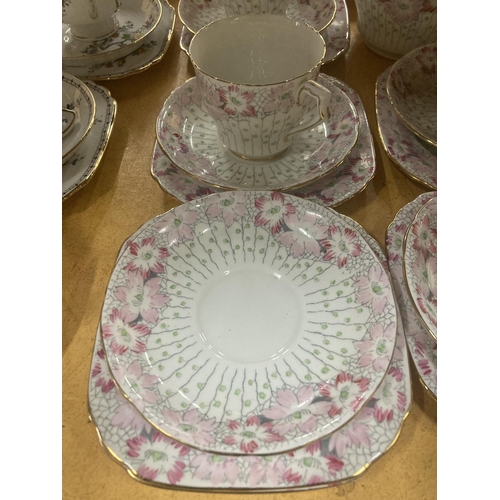 216 - A DELPHINE CHINA TEA AND COFFEE SET IN A PALE PINK FLORAL PATTERN TO INCLUDE A TEA POT, COFFEE POT, ... 