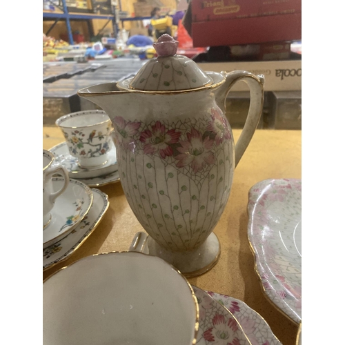 216 - A DELPHINE CHINA TEA AND COFFEE SET IN A PALE PINK FLORAL PATTERN TO INCLUDE A TEA POT, COFFEE POT, ... 