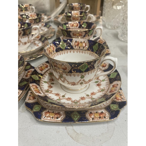 233 - A LARGE QUANTITY OF ST. MICHAEL CHINA CUPS, SAUCERS, PLATES, CREAM JUG AND SUGAR BOWL