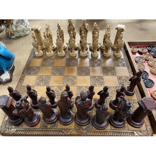 259 - A WOODEN CHESS BOARD WITH RESIN ROMAN FIGURE CHESS PIECES - 3 A/F PLUS A BACKGAMMON/DRAUGTS BOARD WI... 