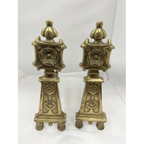 26 - A PAIR OF BRASS FIRE DOGS