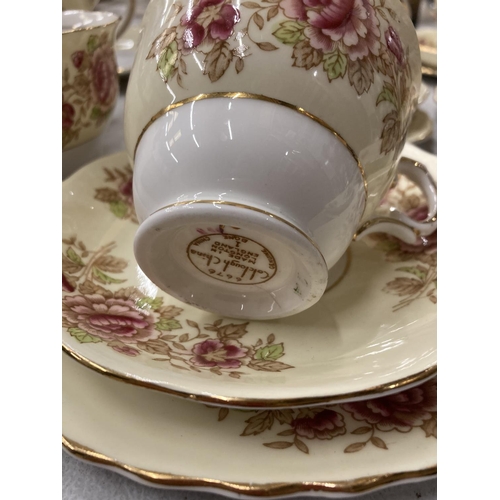 264 - A COLCLOUGH CHINA TEASET IN A PALE YELLOW WITH FLORAL DECORATION TO INCLUDE A CAKE PLATE, CREAM JUG,... 