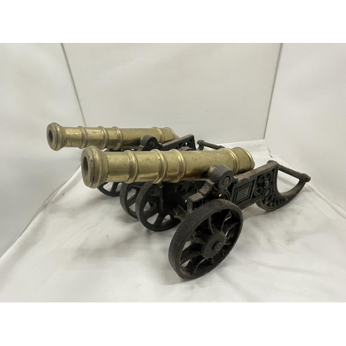 27 - A PAIR OF HEAVY BRASS AND CAST CANNONS