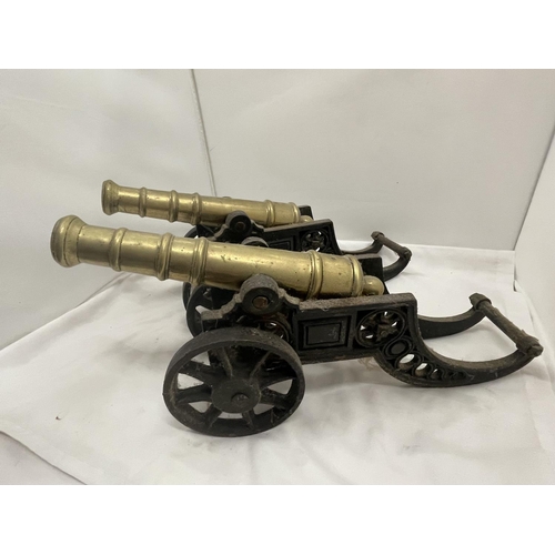 27 - A PAIR OF HEAVY BRASS AND CAST CANNONS