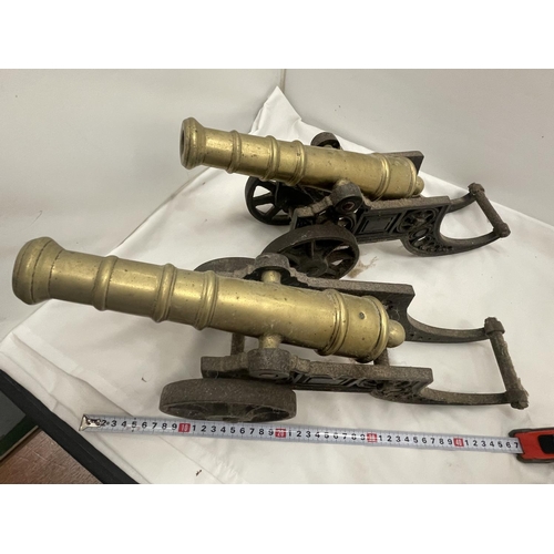 27 - A PAIR OF HEAVY BRASS AND CAST CANNONS