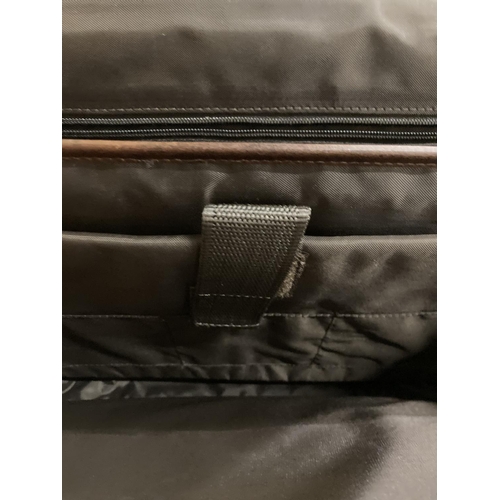 272 - A BROWN WILSON'S LEATHER BRIEF CASE WITH HANDLE