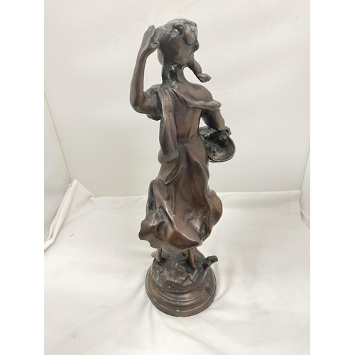 29 - A BRONZE STYLE FIGURE OF A LADY WITH A BASKET HEIGHT 45CM