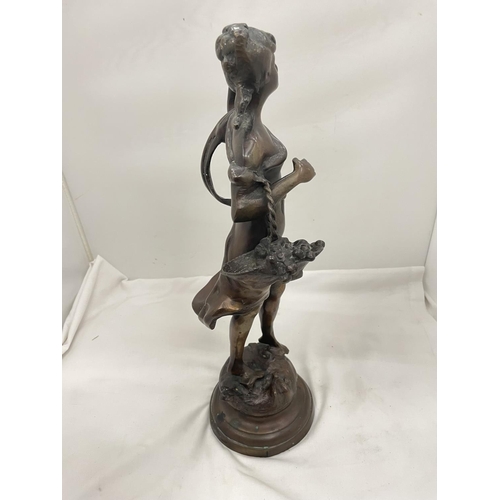 29 - A BRONZE STYLE FIGURE OF A LADY WITH A BASKET HEIGHT 45CM