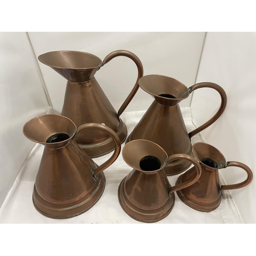 32 - A SET OF FIVE VINTAGE GRADUATED COPPER JUGS