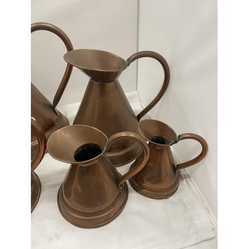 32 - A SET OF FIVE VINTAGE GRADUATED COPPER JUGS