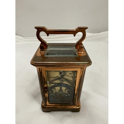 5A - A COPPER CARRIAGE CLOCK WITH BRASS MOVEMENT BY Wm BUFORD AND SON EASTBOURNE AND EXETER WITH TOP ESCA... 