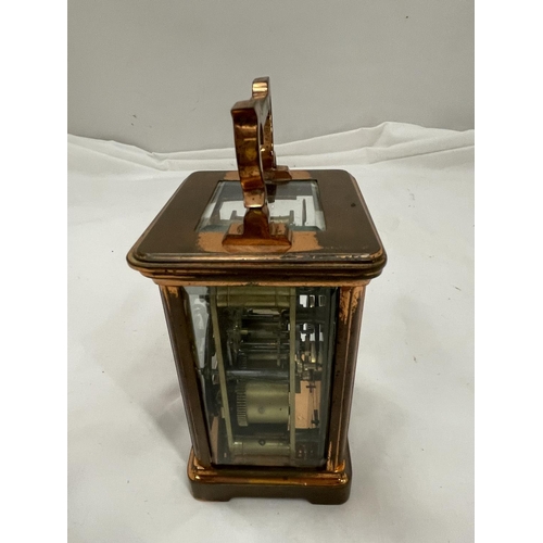 5A - A COPPER CARRIAGE CLOCK WITH BRASS MOVEMENT BY Wm BUFORD AND SON EASTBOURNE AND EXETER WITH TOP ESCA... 