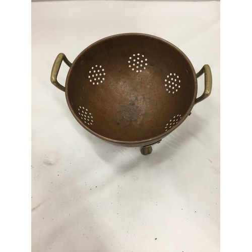 151 - A BRASS AND COPPER COLLANDER DIAMETER 16CM