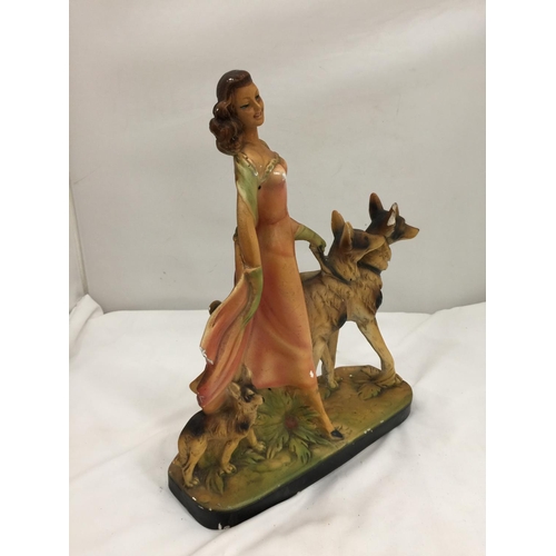 162 - AN EARLY 20TH CENTURY ART DECO STYLE CHALKWARE FIGURE OF A LADY AND TWO GERMAN SHEPHERDS MARKED RD 8... 