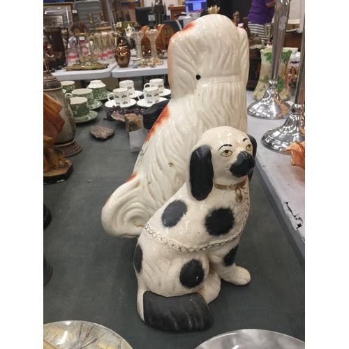 178 - A LARGE RED AND WHITE STAFFORDSHIRE DOG HEIGHT 34CM PLUS A SMALLER BLACK AND WHITE ONE HEIGHT 23CM