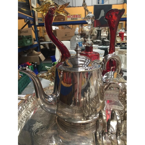 197 - A QUANTITY OF SILVER PLATED ITEMS TO INCLUDE TWO TRAYS, A TEAPOT, SAUCE BOAT AND TOAST RACK