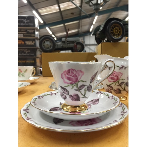 205 - A ROYAL STANDARD 'ROSE MAXI' TEASET TO INCLUDE A CAKE PLATE, CREAM JUG, SUGAR BOWL, FIVE CUPS, SAUCE... 