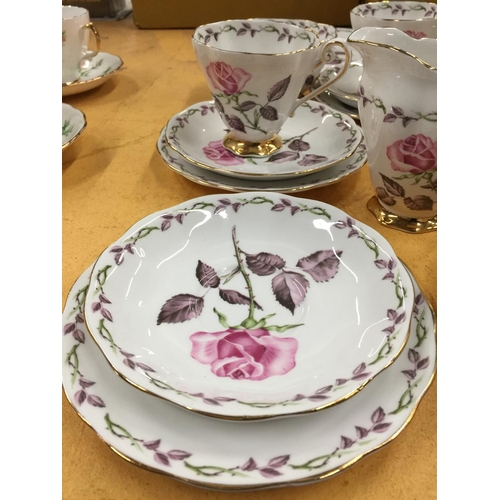 205 - A ROYAL STANDARD 'ROSE MAXI' TEASET TO INCLUDE A CAKE PLATE, CREAM JUG, SUGAR BOWL, FIVE CUPS, SAUCE... 