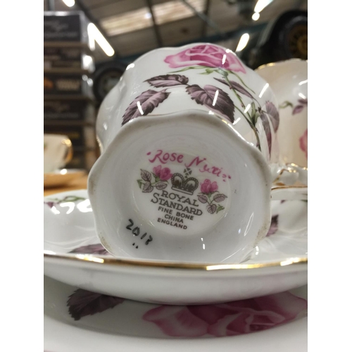 205 - A ROYAL STANDARD 'ROSE MAXI' TEASET TO INCLUDE A CAKE PLATE, CREAM JUG, SUGAR BOWL, FIVE CUPS, SAUCE... 