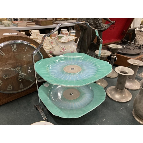 125A - A SHELLEY ART DECO CAKE STAND WITH CHROME HANDLE IN A GREEN AND BLUE PATTERN