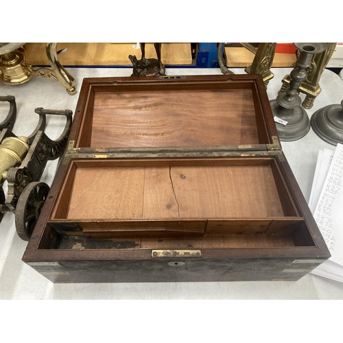 28 - A MAHOGANY AND BRASS BOUND BOX WITH A SECRET DRAWER