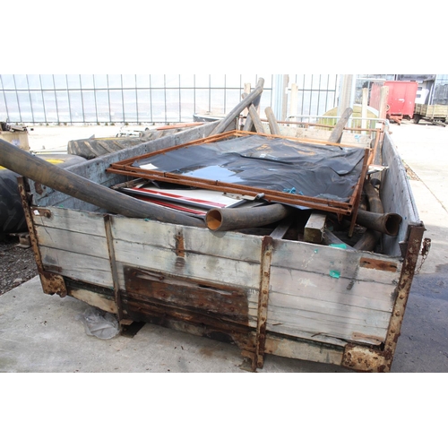 239 - A WOODEN TRAILER BODY WITH AN ASSORTMENT OF PLASTIC PIPES, TYRES AND SIGNS +VAT