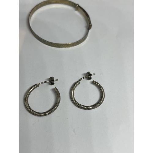 624 - TWO MARKED SILVER BANGLES AND TWO PAIRS OF SILVER EARRINGS