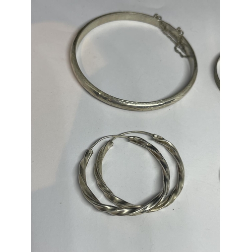 624 - TWO MARKED SILVER BANGLES AND TWO PAIRS OF SILVER EARRINGS