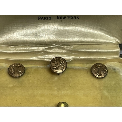 633 - THREE YELLOW METAL COLLAR STUDS IN A PRESENTATION BOX