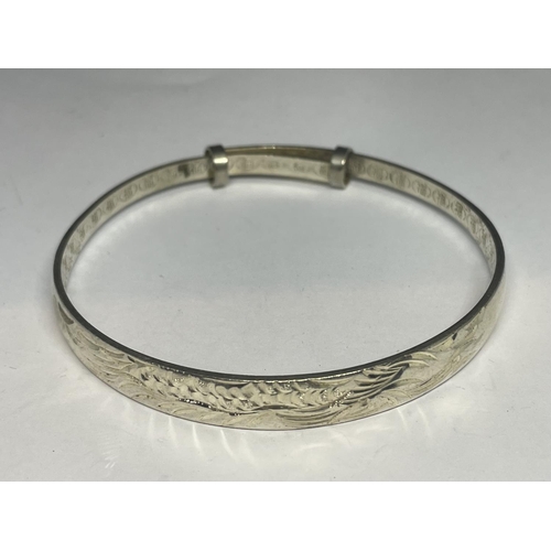 637 - TWO SILVER BANGLES