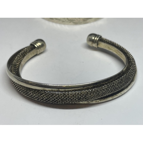 637 - TWO SILVER BANGLES