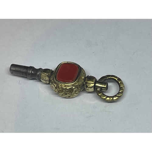 638 - AN ORNATE GOLD PLATED WATCH KEY