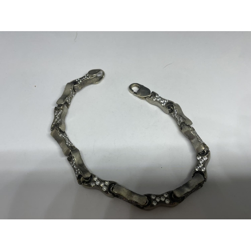 639 - A SILVER BRACELET WITH STONES