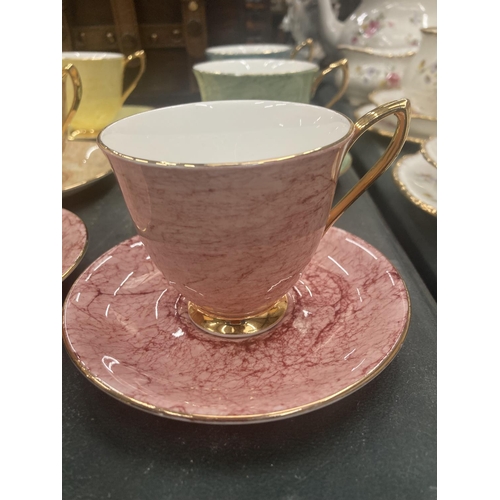 59 - A QUANTITY OF ROYAL ALBERT 'GOSSAMER' CUPS AND SAUCERS IN DIFFERENT COLOURS ( 10 IN TOTAL )