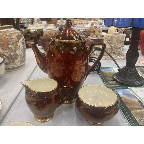 77 - A CARLTON WARE COFFEE SET IN A CRISOM LUSTRE WARE TO INCLUDE COFFEE SET, SUGAR BOWL, CREAM JUG, CUPS... 