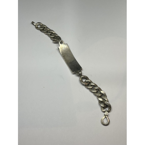 526 - A HEAVY SILVER IDENTITY BRACELET