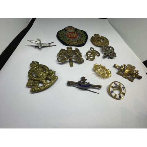 539 - ELEVEN MILITARY BADGES