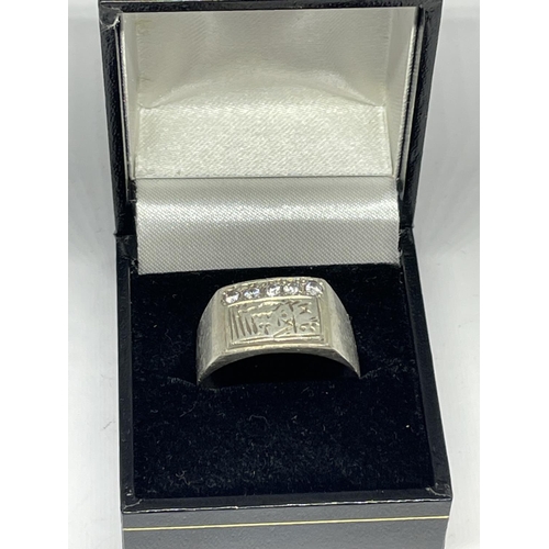 544 - A SILVER ASIAN RING WITH A PRESENTATION BOX