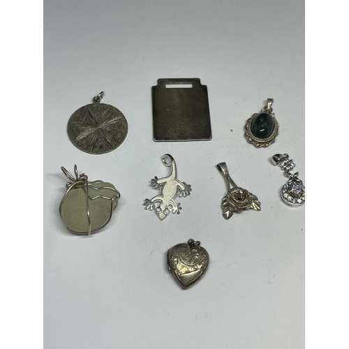 561 - EIGHT SILVER PENDANTS