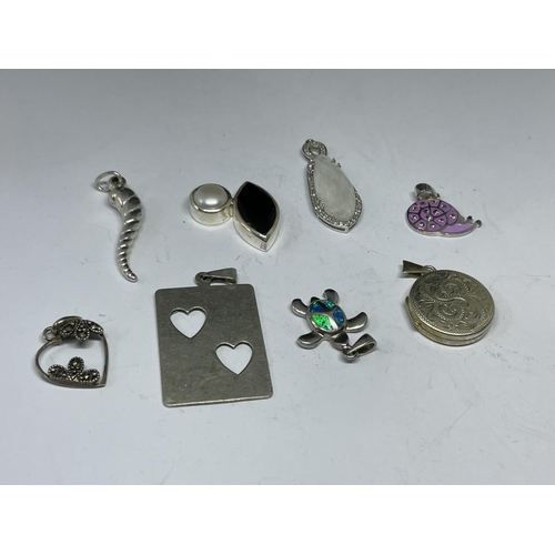 577 - EIGHT SILVER PENDANTS