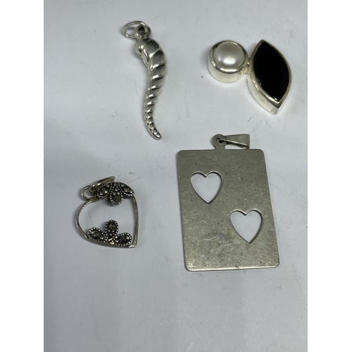 577 - EIGHT SILVER PENDANTS